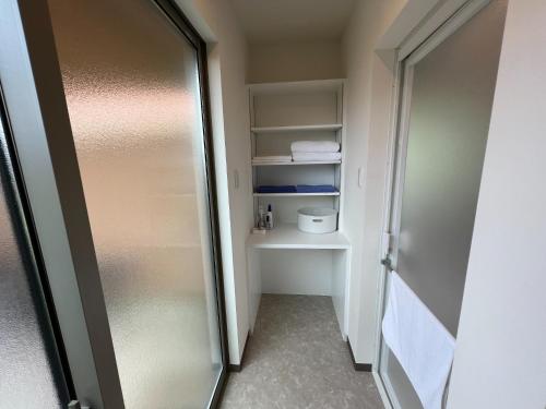 a walk in shower in a room with a refrigerator at The Villa with a YAMAHA C6X - Villa Muse Okinawa- Vacation STAY 43827v in Nago