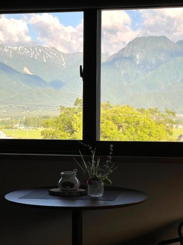 a window with a table with a potted plant on it at CANOA GUEST HOUSE A room - Vacation STAY 50937v in Ikeda