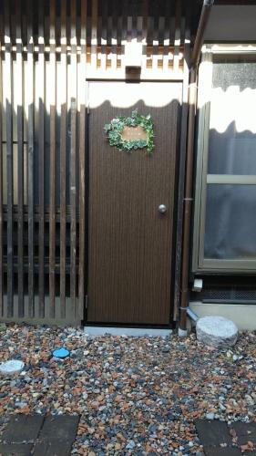 a wooden door with a wreath on it at base sanablend - Vacation STAY 37411v in Kyotango