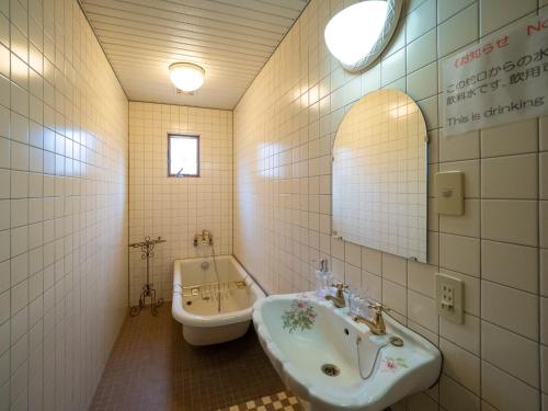 a bathroom with a sink and a tub at Montania Nasu Grande - Vacation STAY 59678v in Shiozawa