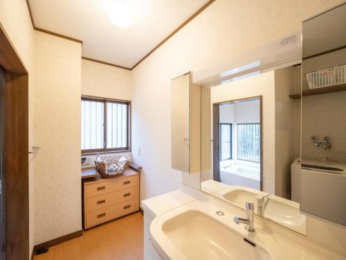 a bathroom with a sink and a mirror at MOCHA House - Vacation STAY 12999 in Nasu-yumoto