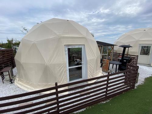 two yurt tents are set up in a yard at Blissful Garden - Vacation STAY 46374v in Shibukawa