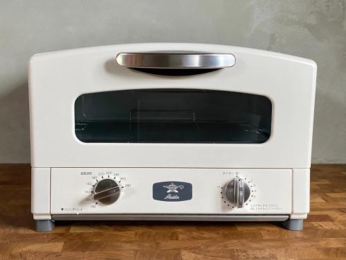 a white toaster oven with a bowl on top at Cottage Coliberty - Vacation STAY 60526v in Anan