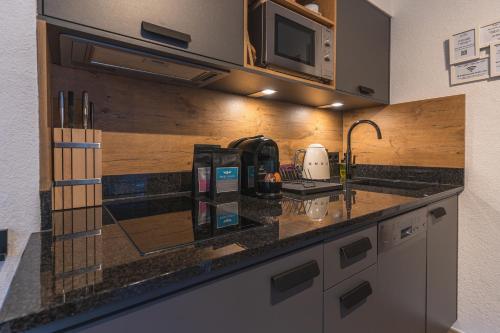 Dorfchalets - Appartement Rosi inkl Tauern Spa Therme Eintritt & Sommerkarte
