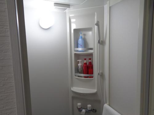 a bathroom with a shower stall with a bottle of liquid at Villa House Hisago - Vacation STAY 61410v in Kawazu