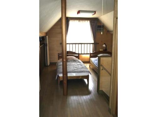 a small bedroom with a bed and a window at Villa Le Port - Vacation STAY 61630v in Abuta