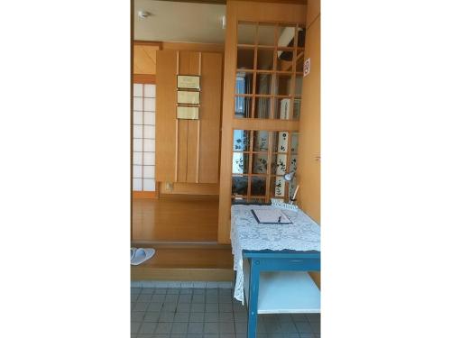 a room with a table and a glass door at Villa Le Port - Vacation STAY 61630v in Abuta