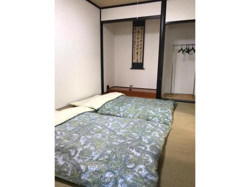 a bedroom with a bed in a room at Family House - Vacation STAY 53010v in Kumamoto