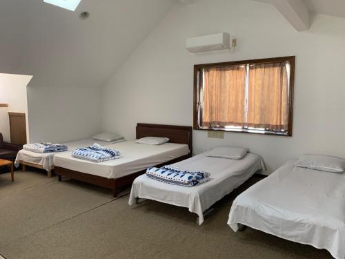 Giường trong phòng chung tại Family House "2F" - Vacation STAY 13805