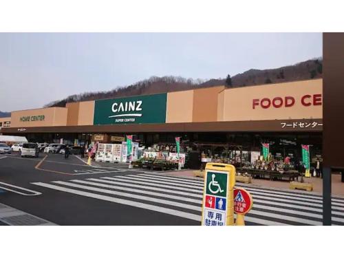 a food store on a street with a crosswalk at Log House Kizuki - Vacation STAY 62486v in Tsuru 