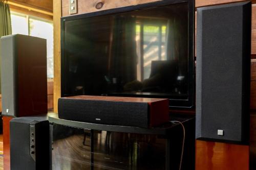 a large black television with a speaker and a speaker at Log House Kizuki - Vacation STAY 62486v in Tsuru 