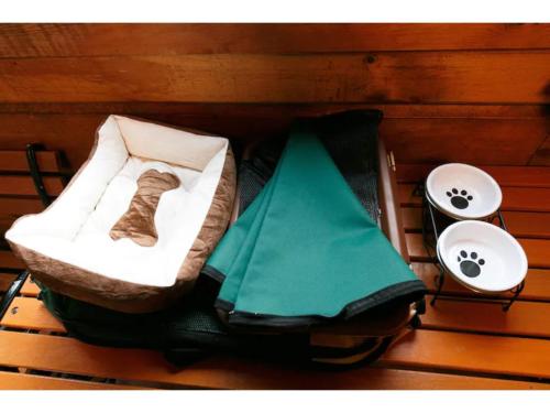 a bed with a sock on it next to two sinks at Log House Seseragi - Vacation STAY 62500v in Tsuru 