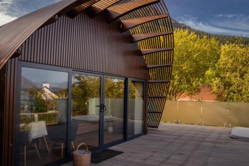 a pavilion with glass doors and a patio at Murrayshall Country Estate in Perth