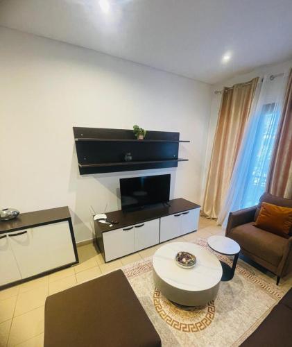a living room with a couch and a table at Saurrier in Motsouémbé
