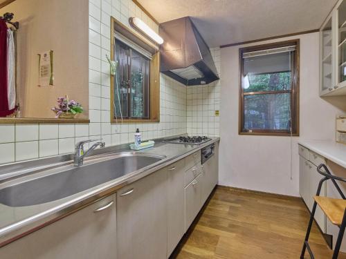 a kitchen with a large sink and a counter at Runesu Karuizawa - Vacation STAY 78403v in Tsumagoi