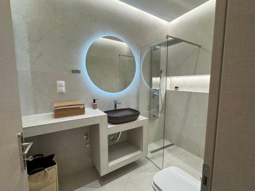 a bathroom with a sink and a mirror at ALIKKIS The Boutique Stay Experience in Stavros