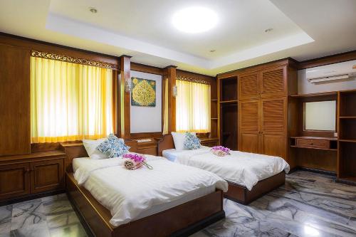 Ένα ή περισσότερα κρεβάτια σε δωμάτιο στο Private Lamai Marble Villa