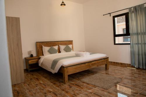 Postel nebo postele na pokoji v ubytování Hotel Hojari - Jabal Samhan, Salalah