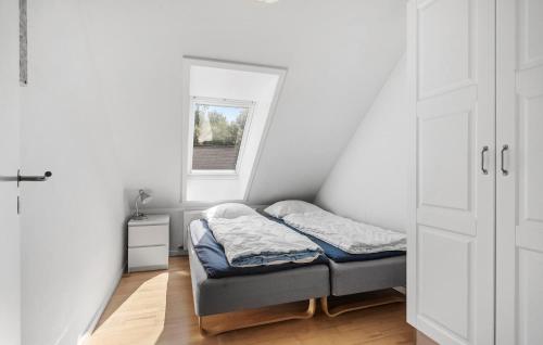 a small room with a bed and a window at 3 Bedroom Nice Apartment In Nimtofte in Nimtofte