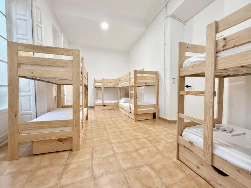 Postel nebo postele na pokoji v ubytování La Merced Nomada & Boutique Hostel
