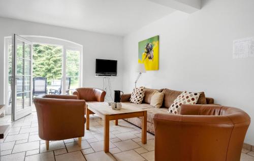 a living room with a couch and chairs and a table at Awesome Apartment In Nimtofte With Wifi in Nimtofte