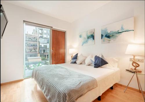 Ένα ή περισσότερα κρεβάτια σε δωμάτιο στο Modernismo Paseo de Gracia