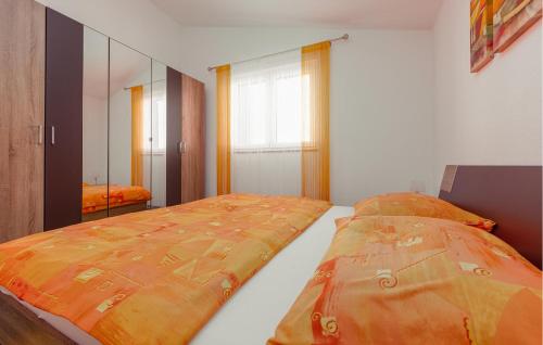 a bedroom with a bed and a large window at Stunning Apartment In Vrsi Mulo With Wifi in Kod Mula