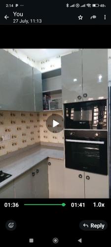 a kitchen with a stove top oven in a kitchen at Victory homes in Oko Abe