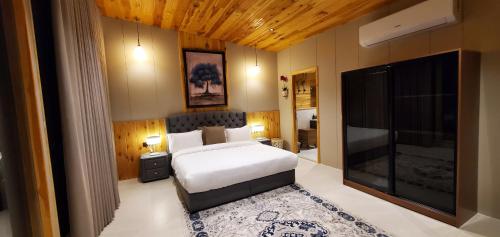 Postel nebo postele na pokoji v ubytování Wakan Farm Villas El Souda - مزرعة وكن الريفية - قرية شرمه
