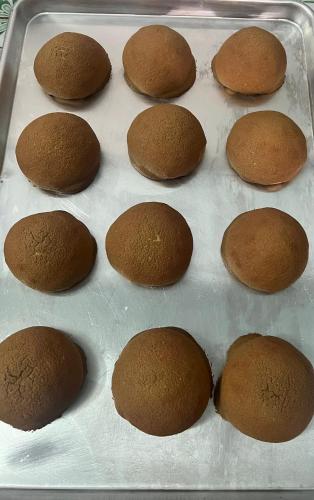 a tray of brown muffins sitting on top at Uyen's House in Con Dao