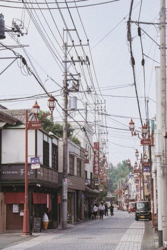 a street with a lot of wires and buildings at Chichibu Nostalgia ちちぶの情景 in Chichibu