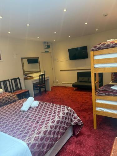 En eller flere senge i et værelse på Albro House Hotel, London