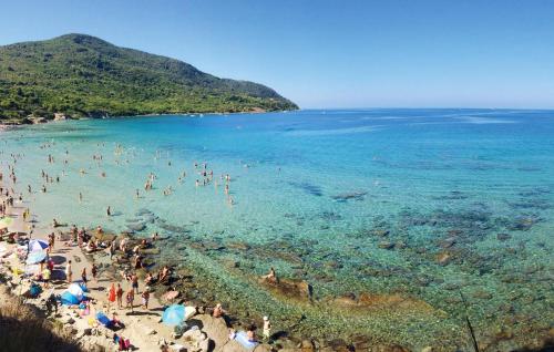 a group of people on a beach in the water at Amazing Home In Giungano in Giungano