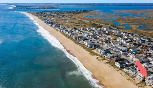 an aerial view of a beach with houses and the ocean at Beachfront Panoramic Views Oceanfront Oasis in Salisbury