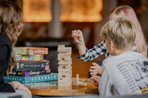 a group of children playing a board game at Hotel Marina Club in Olsztyn