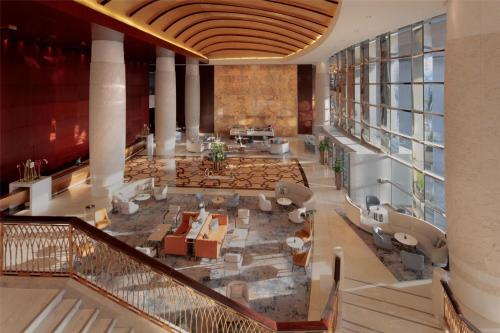 an overhead view of a hotel lobby with couches at Conrad Dubai in Dubai