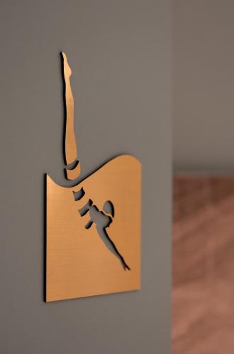 a picture of a person on a wall at Hotel & Spa Oceania Lille Les Augustins in Lille
