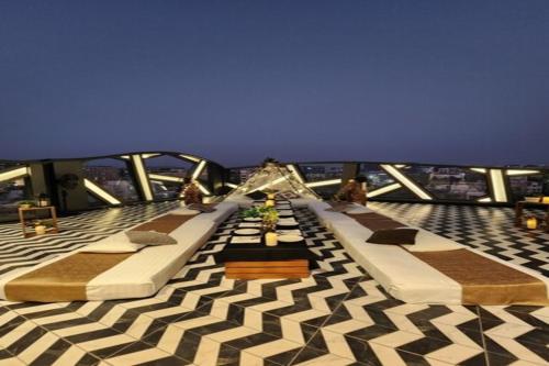 a room with several beds on a cruise ship at Dragonfly Hotel - The Art Hotel in Mumbai