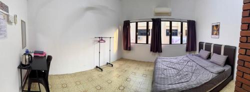 Una cama o camas en una habitación de 阳光民宿 Yang Guang Guesthouse