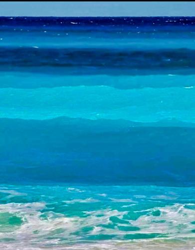 a large body of blue water with at Akrata Golden Beach House 2 in Aíyira