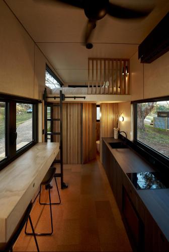 a kitchen with a counter and a fish tank at Nestled Cabins