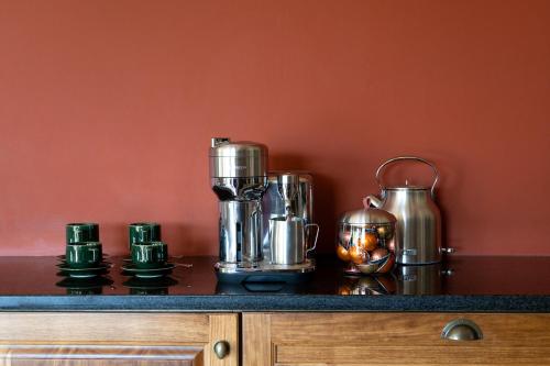 a counter with a bunch of silver appliances on it at Tamodi Estate in Plettenberg Bay
