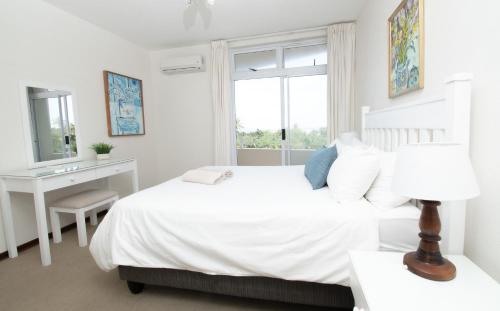 Ένα ή περισσότερα κρεβάτια σε δωμάτιο στο 12 Sea Lodge