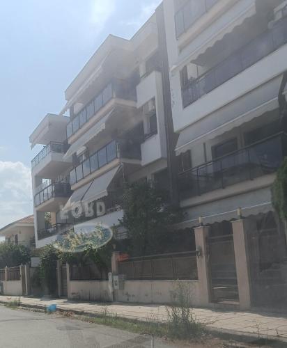 a large building with a hotel sign in front of it at Ζ Luxury in Thessaloniki