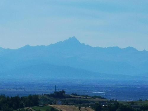 a view of a mountain in the distance at Hillview Langhe Apartment in Belvedere Langhe