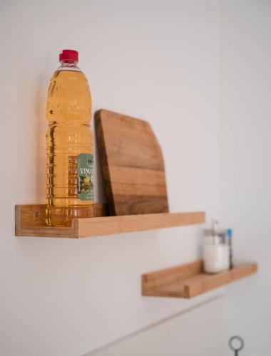 a bottle of mustard sitting on a shelf at La casa Zamora in Totana