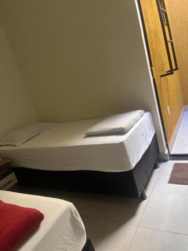 a bedroom with two beds in a room at casa nova no guara proxima ao aeroporto in Brasilia