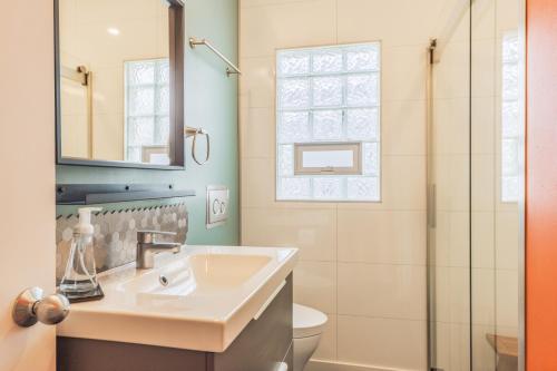 a bathroom with a sink and a shower at Experience lakeside tranquility at The 9 in Douglas