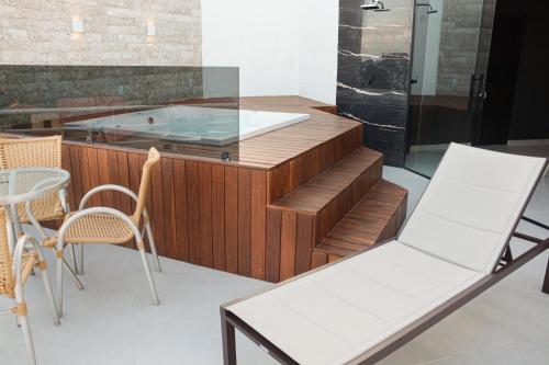 a restaurant with a glass counter with chairs and a table at Top View RN in Nísia Floresta