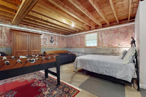 a bedroom with a bed and a pool table at The Lucky Lobster in York